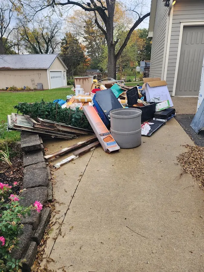 Dumpster being loaded with debris for Estate Cleanout Dumpster Rental in Castle Rock